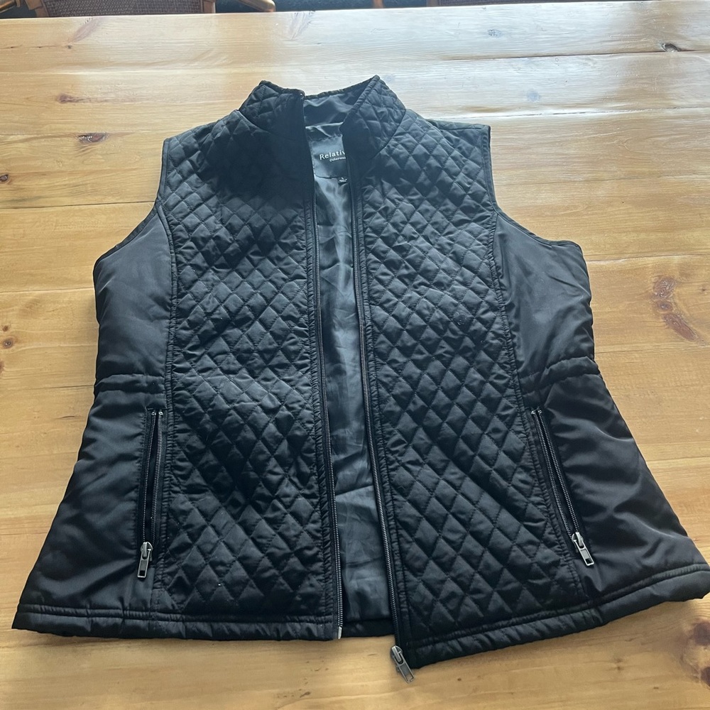 Black quilted vest. Only worn a couple of times. Size XL